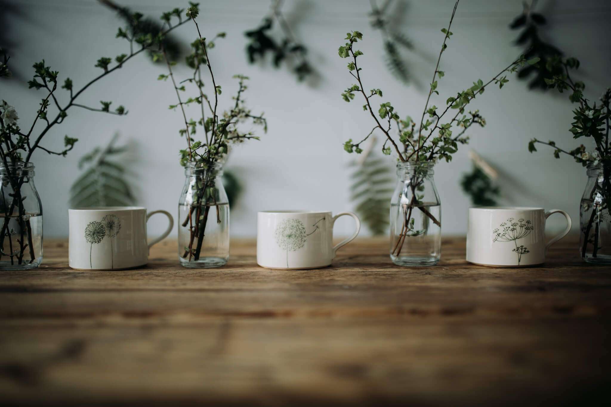 WC white green mugs all