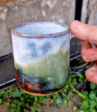alpine forest mug in hand