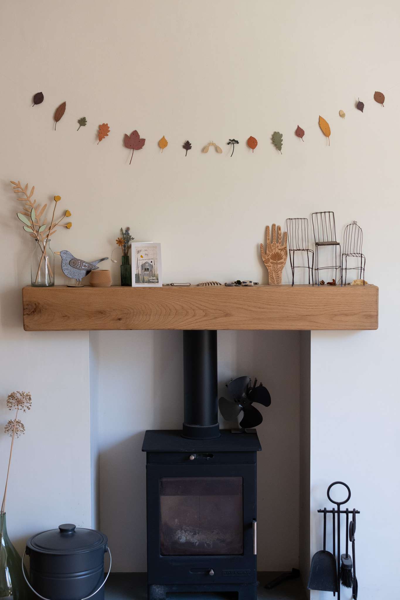 autumn leaves above fireplace main